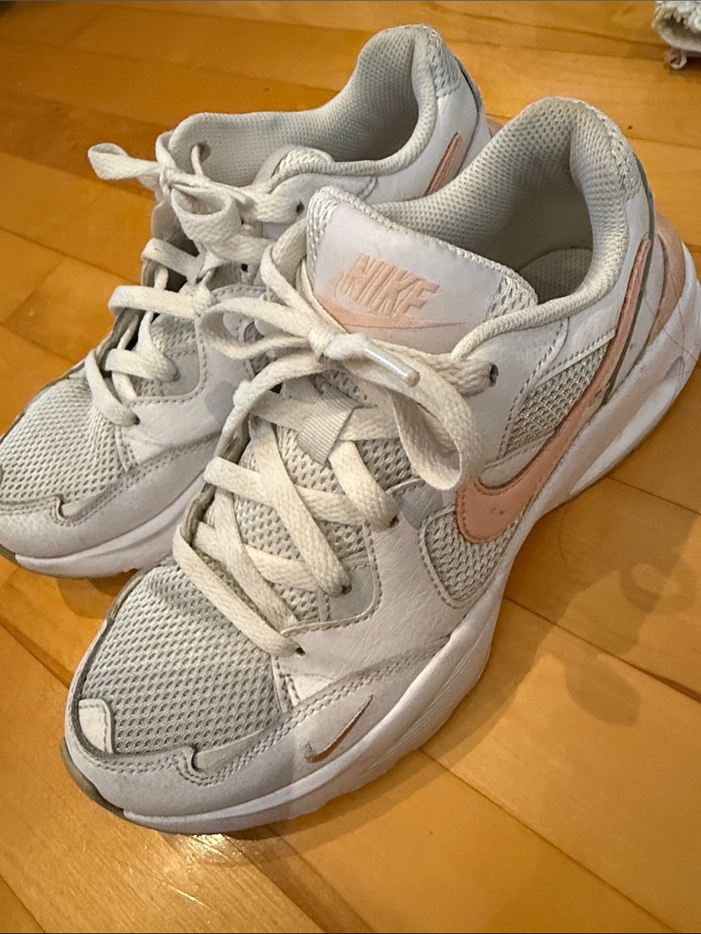 Nike Women's White Athletic Sneakers with Light Pink Swoosh